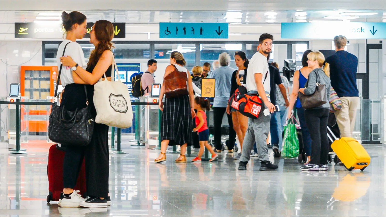 Lesbian couple says goodbye at airport in Portugal