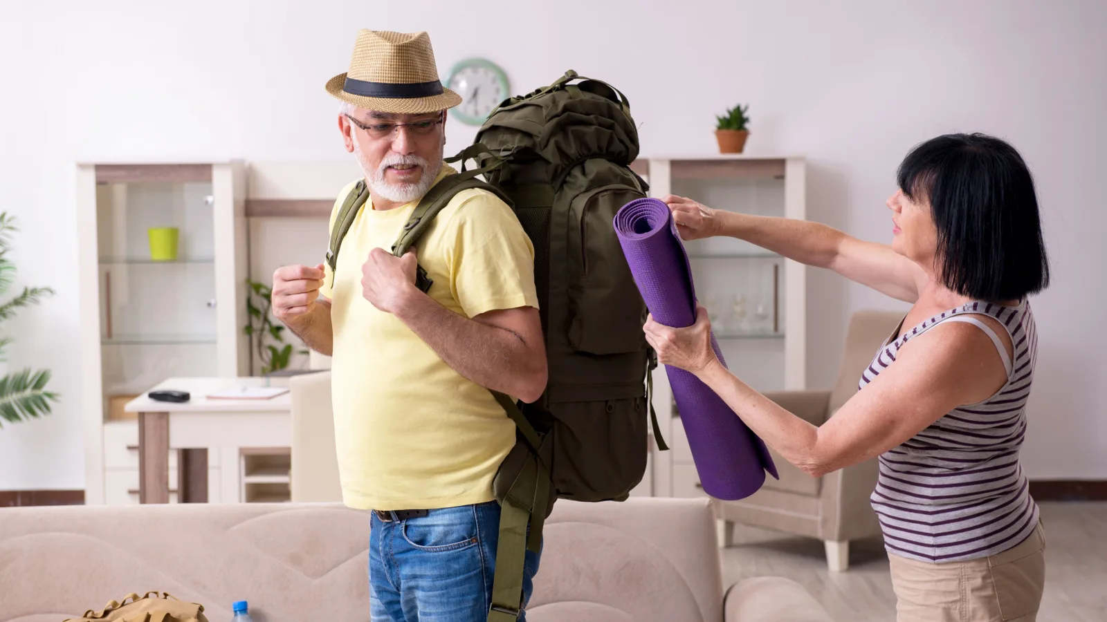 Senior couple pack a bag to move abroad