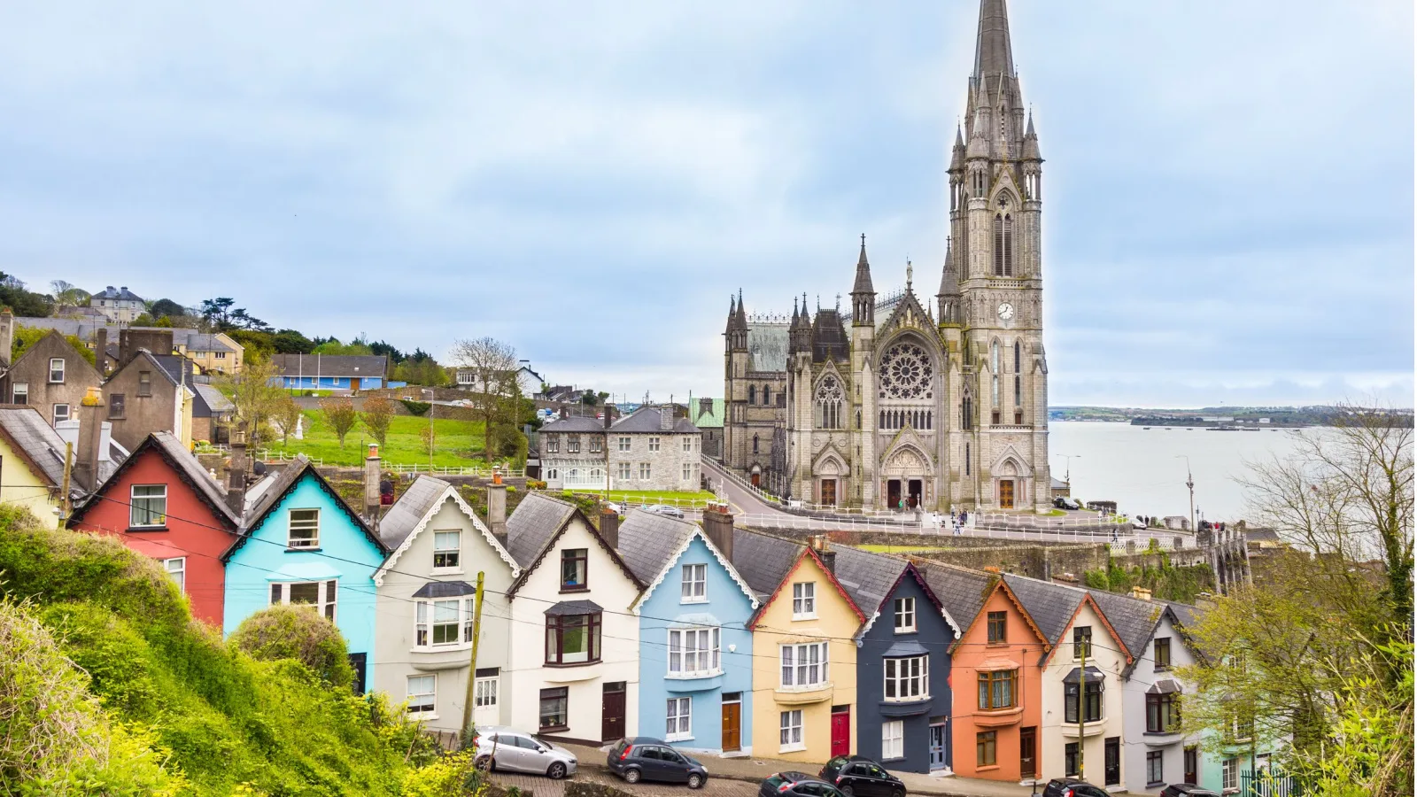A small coastal town in Ireland, with an old cathedral in the background