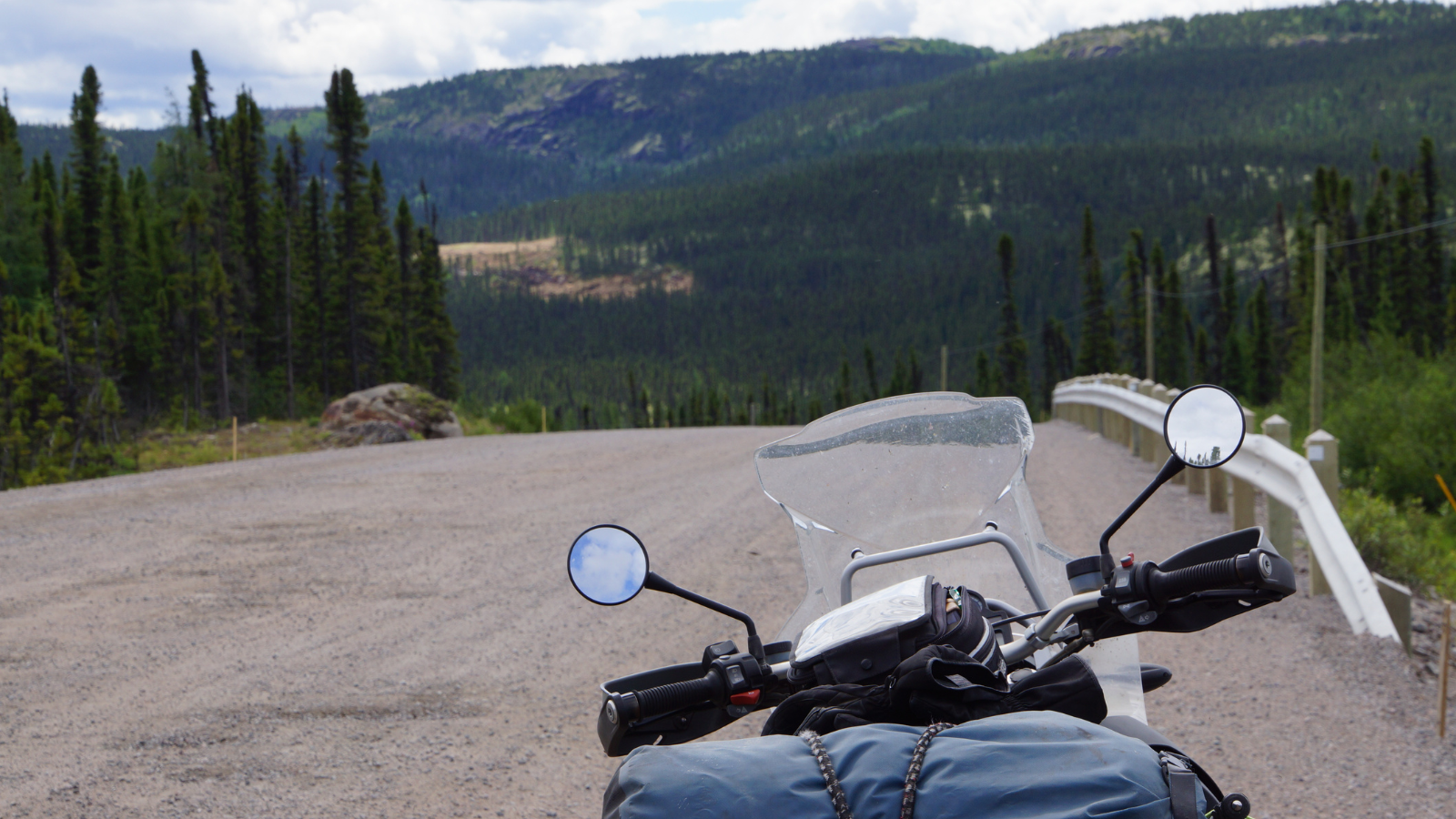 A motorcycle driving down a road.